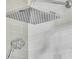 Modern bathroom shower featuring sleek gray tile, and both rainfall and handheld shower heads at 1992 Pierce St, Charleston, SC 29492
