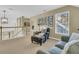 Cozy sitting area with a comfortable chair, ottoman, and lots of natural light at 1992 Pierce St, Charleston, SC 29492