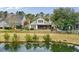 Backyard with a screened in porch and overlooking the pond at 2128 Baldwin Park Dr, Mount Pleasant, SC 29466
