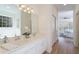 Bathroom with a double vanity and a view to the bathtub and the bedroom in the background at 2128 Baldwin Park Dr, Mount Pleasant, SC 29466