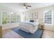 Serene bedroom bathed in natural light, featuring a large bed and calming decor at 2128 Baldwin Park Dr, Mount Pleasant, SC 29466