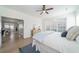 Bright bedroom with windows, plush bed, and view to an adjacent living and dining area at 2128 Baldwin Park Dr, Mount Pleasant, SC 29466