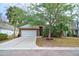 Charming brick home with a two-car garage and mature trees in a desirable neighborhood at 2128 Baldwin Park Dr, Mount Pleasant, SC 29466