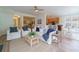 Spacious living room with plush seating, a ceiling fan, and an open view into the kitchen at 2128 Baldwin Park Dr, Mount Pleasant, SC 29466