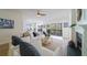 Comfortable living room with a ceiling fan, fireplace, sliding glass doors, and plush furniture at 2128 Baldwin Park Dr, Mount Pleasant, SC 29466