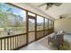 A bright screened-in porch features comfortable seating and access to an outside view at 2128 Baldwin Park Dr, Mount Pleasant, SC 29466