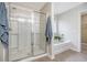Bright bathroom featuring a glass-enclosed shower, soaking tub, and neutral color palette at 222 Medford Dr, Summerville, SC 29485