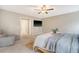 Spacious bedroom with a seating area, mounted TV, and a calm, neutral color scheme at 222 Medford Dr, Summerville, SC 29485