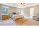 A bright primary bedroom with a large bed, side tables, and windows for natural light at 222 Medford Dr, Summerville, SC 29485