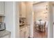 Convenient butler's pantry with granite countertops, white cabinets, and modern appliances at 222 Medford Dr, Summerville, SC 29485