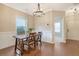 Elegant dining room with hardwood floors, wainscoting, and a modern chandelier at 222 Medford Dr, Summerville, SC 29485