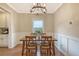 Dining area with hardwood floors, decorative wainscoting, and a window view at 222 Medford Dr, Summerville, SC 29485