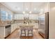 Spacious kitchen featuring white cabinets, granite countertops, and stainless steel appliances at 222 Medford Dr, Summerville, SC 29485
