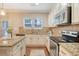 Bright kitchen with granite countertops, stainless steel appliances, and ample cabinet space at 222 Medford Dr, Summerville, SC 29485