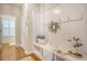 A stylish mudroom with beadboard paneling, coat hooks, bench seating, and built-in storage at 222 Medford Dr, Summerville, SC 29485