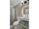 Small bathroom featuring a modern sink and vanity, shower with a decorative curtain, and toilet at 223 Fox Field Rd, Walterboro, SC 29488