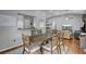 Open concept floor plan with a dining area, showcasing hardwood floors and access to the living room at 223 Fox Field Rd, Walterboro, SC 29488