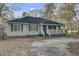The home has an inviting front porch with white railings, creating a cozy and classic curb appeal at 223 Fox Field Rd, Walterboro, SC 29488