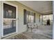 Relax on this inviting porch with seating area, and an easy access door to welcome guests into the home at 223 Fox Field Rd, Walterboro, SC 29488