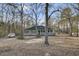 Charming single-story home with a welcoming front porch surrounded by mature trees and a spacious yard at 223 Fox Field Rd, Walterboro, SC 29488
