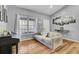 Cozy second living room area with a rustic hardwood floor and bright windows creating a relaxing atmosphere at 223 Fox Field Rd, Walterboro, SC 29488