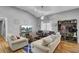 Bright living room with modern furniture, a fireplace, and a ceiling fan at 223 Fox Field Rd, Walterboro, SC 29488