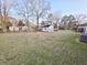 Spacious backyard featuring a large grassy area, utility shed, and bordered by a chain-link fence at 228 Jean Wells Dr, Goose Creek, SC 29445