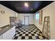 Expansive basement features a checkered floor, large storage space, and stairs at 228 Jean Wells Dr, Goose Creek, SC 29445