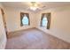 Cozy bedroom featuring neutral walls, carpeted floor, and windows at 228 Jean Wells Dr, Goose Creek, SC 29445