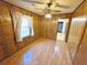 Charming dining room with wood paneling, laminate flooring, and a ceiling fan at 228 Jean Wells Dr, Goose Creek, SC 29445