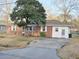 A charming brick house with a well-kept yard and driveway, presenting a welcoming and classic curb appeal at 228 Jean Wells Dr, Goose Creek, SC 29445