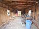 Rustic shed interior with workbench, shelving, and natural light at 228 Jean Wells Dr, Goose Creek, SC 29445