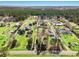 Expansive aerial view showing the property and surrounding acreage, with mature trees and open land at 2285 Cooper Store Rd, Moncks Corner, SC 29461