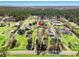 Expansive aerial view showing the property and surrounding acreage, with mature trees and open land at 2285 Cooper Store Rd, Moncks Corner, SC 29461