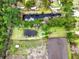 Aerial view of property with canal, pond, landscaping, and paddock at 2285 Cooper Store Rd, Moncks Corner, SC 29461