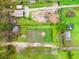 Aerial view of the property with outbuildings, and cleared areas at 2285 Cooper Store Rd, Moncks Corner, SC 29461