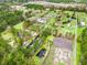 Aerial view of property and neighborhood featuring canal, pond, landscaping, and paddock at 2285 Cooper Store Rd, Moncks Corner, SC 29461