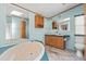 Bright bathroom featuring a soaking tub, dual sinks, and ample counter space at 2285 Cooper Store Rd, Moncks Corner, SC 29461