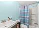 Bathroom features blue walls, a shower with a curtain, and a vanity at 2285 Cooper Store Rd, Moncks Corner, SC 29461
