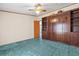 Bedroom with wall to wall carpet and built in storage cabinets along the right wall at 2285 Cooper Store Rd, Moncks Corner, SC 29461