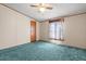 Bedroom featuring wall to wall carpet, a window, and a ceiling fan with light at 2285 Cooper Store Rd, Moncks Corner, SC 29461