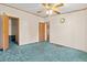 Bedroom with wall to wall carpet, ceiling fan, and a closet with a shelf at 2285 Cooper Store Rd, Moncks Corner, SC 29461