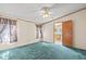 Comfortable bedroom with a ceiling fan and view leading into the bathroom at 2285 Cooper Store Rd, Moncks Corner, SC 29461
