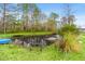 Picturesque pond with clear water, featuring a small pier, providing a tranquil setting at 2285 Cooper Store Rd, Moncks Corner, SC 29461