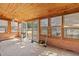 Enclosed sunroom with natural light, featuring an open door with windows, and ceiling fan at 2285 Cooper Store Rd, Moncks Corner, SC 29461