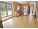 Bright kitchen with wood cabinets, stainless steel refrigerator, and sun-filled windows at 243 Country Club Blvd, Saint George, SC 29477