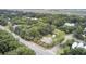 Aerial view of a neighborhood surrounded by lush trees, highlighting the property's location at 2530 Jasper Blvd, Sullivans Island, SC 29482