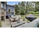 Outdoor deck area with a dining table, grill, and comfortable seating, perfect for entertaining guests at 2530 Jasper Blvd, Sullivans Island, SC 29482