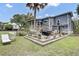 Full backyard view featuring a deck area, patio furniture, and grill; an outdoor oasis at 2530 Jasper Blvd, Sullivans Island, SC 29482
