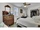 Bright bedroom with vintage wooden dresser and a view of the attached closet at 2530 Jasper Blvd, Sullivans Island, SC 29482